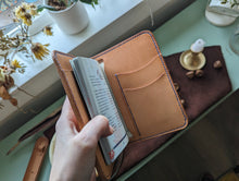 Load image into Gallery viewer, A unique luxury handmade leather passport holder made in Vancouver. It can hold up to four passports, boarding passes and payment cards. Perfect for a solo or a parent traveller.