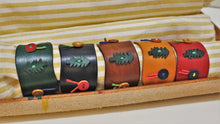 Load image into Gallery viewer, handmade leather Christmas napkin rings made in Vancouver Canada - Christmas gifts
